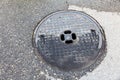 Round sewer manhole cast iron Royalty Free Stock Photo