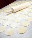 Round shape of the dough and rolling pin Royalty Free Stock Photo