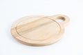 Round-shaped wooden chopping board isolated on a white background Royalty Free Stock Photo