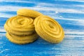 Round shortbread cookies lying on a wooden blue table