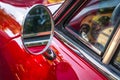 Side mirror of a vintage red car Royalty Free Stock Photo