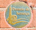 Round sidewalk medallion in Spanish on Baltimore`s Heritage Walk