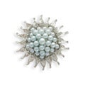 Round silver brooch with blue pearls isolated on white Royalty Free Stock Photo