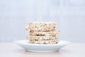 Round slices of diet crispbread close-up on a plate on kitchen table Royalty Free Stock Photo