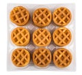 Round small waffles in plastic container isolated on white background