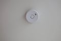 Round smoke detector on ceiling Royalty Free Stock Photo