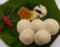 Idli, idly with sambar and coconut chutney on banana leaf