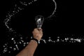 a round splash of water through wine glass celebration in a party