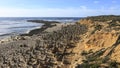 Round stacked stones on the shore Royalty Free Stock Photo