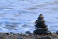 Round stacked stones on the shore Royalty Free Stock Photo