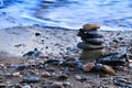 Round stacked stones on the shore Royalty Free Stock Photo