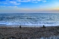 Round stacked stones on the shore Royalty Free Stock Photo