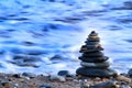 Round stacked stones on the shore Royalty Free Stock Photo