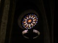 Round stained glass window with the flag of Catalonia at Collegiate church of Santa Maria in