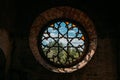 Round stained glass window in old abandoned castle Royalty Free Stock Photo