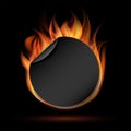 Round sticker or label with fire, advertising for sales. On dark background. Royalty Free Stock Photo