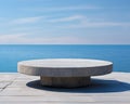 Round stone display table at ocean side is Futuristic.