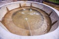 Round Stone Fountain Bowl with Jets in Park Royalty Free Stock Photo