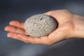 Round stone in hand