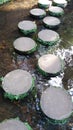 Two ranges of round pavers on water