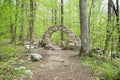 Round stone structure in the woods Royalty Free Stock Photo