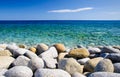 Round stones and clear sea