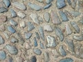 Round stones in the ground Royalty Free Stock Photo