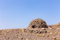 Round stony shelter on the hill in Hajar Mountains, Hatta, United Arab Emirates