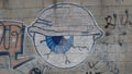 Eye drawn on a brick wall. city mural.