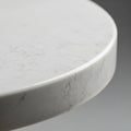 Round surface made of white marble with subtle gray veining. The edge is smooth and Royalty Free Stock Photo