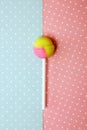 Round sweet candy on a stick. On colored backgrounds