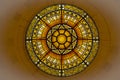 Round shape tainted glass on the ceiling acting like a sun Royalty Free Stock Photo