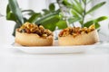 round tartlet with nuts and dried fruits poured with caramel