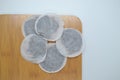 round tea bags on corner wooden background. Royalty Free Stock Photo