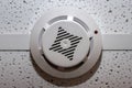 Round temperature sensor on the ceiling. Fire alarm