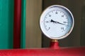 Round temperature sensor on the hot water pipe Royalty Free Stock Photo
