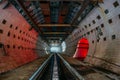 Round tiled tunnel in abandoned underground nuclear physics laboratory Royalty Free Stock Photo