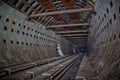 Round tiled tunnel in abandoned underground nuclear physics laboratory