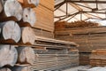 Round timber logs for building wooden house. Removing bark from logs using a machine. Pattern of logs. Woodworking