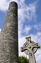 Round tower and celtic cross in Glendalough, Ireland