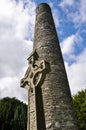 Round tower and celtic cross in Glendalough, Ireland