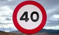 round traffic sign with speed limit over 40 kmh mph