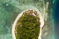 Round tropical island with white sandy beach, top view.A small island surrounded by azure water and coral reefs, a top view Royalty Free Stock Photo