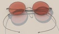 Round vintage glasses with thin metal frames and red lenses