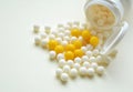 Round vitamins and jar on light background top view Royalty Free Stock Photo