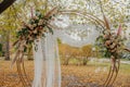 Round wedding arch decorated with flowers