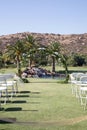 Round wedding arch with eucalyptus leaves, blue hydrangea flowers with waterfall and mountains. Outdoor wedding ceremony