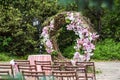 Round wedding arch with fresh flower decoration in pink and white
