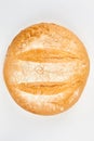 Round wheat bread on white background. Royalty Free Stock Photo