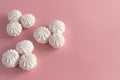 round white airy sweet marshmallow on a pink background.